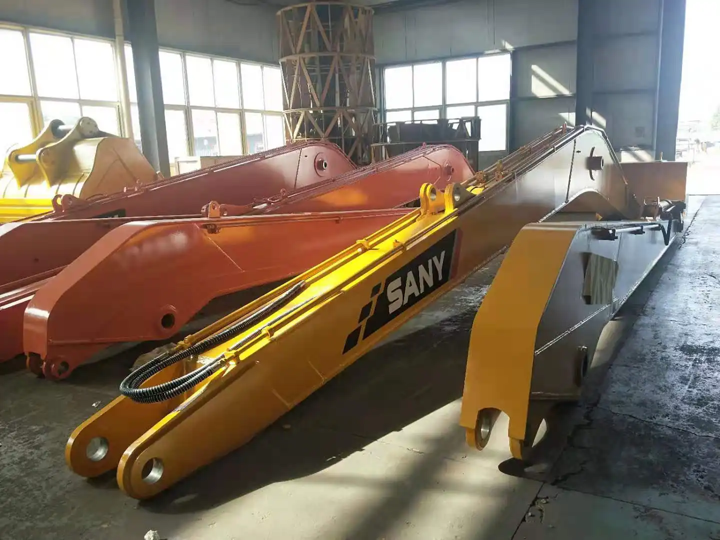 What are the different types of excavator extension arms available?